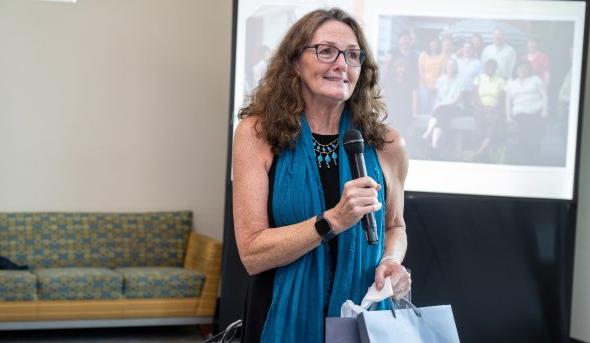 A woman holding a microphone.